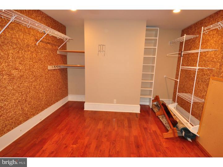 155 Sharp Road Avondale, PA 19311 - Photo 20 of 25 an empty room with wooden floor and windows