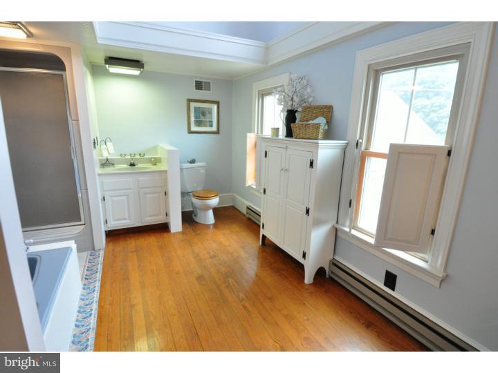 155 Sharp Road Avondale, PA 19311 - Photo 22 of 25 a room with a chair and a view of kitchen