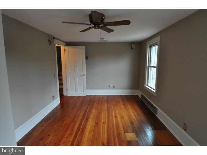 155 Sharp Road Avondale, PA 19311 - Photo 23 of 25 a view of an empty room with wooden floor and a window