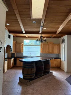 a view of a room with furniture and a ceiling fan