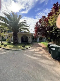 a view of a water fountain in the middle of a yard