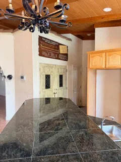 a bathroom with a sink a mirror and bathtub