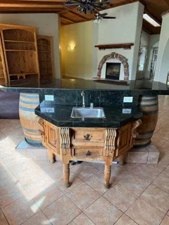 a room with pool table and a chandelier