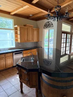 a bathroom with a toilet and a tub
