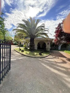 a view of a house with a yard and pathway