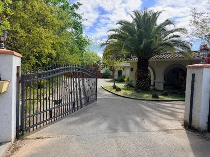 a view of a wrought iron fences in front of house