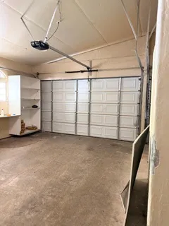 a view of backyard with outdoor seating and green space