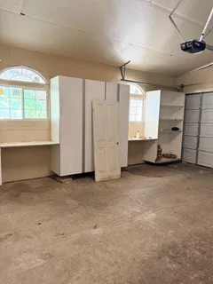 a view of a patio with a table and chairs