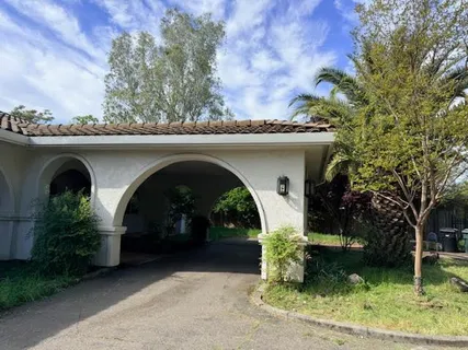 a front view of a house with garden