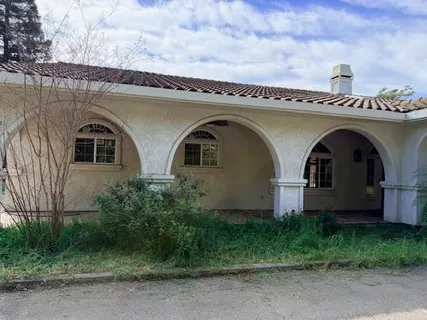 a front view of a house with garden