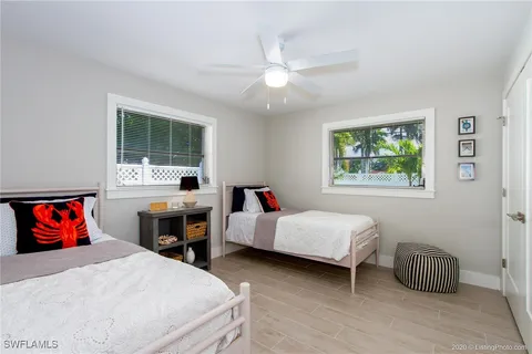 a bedroom with furniture and a window