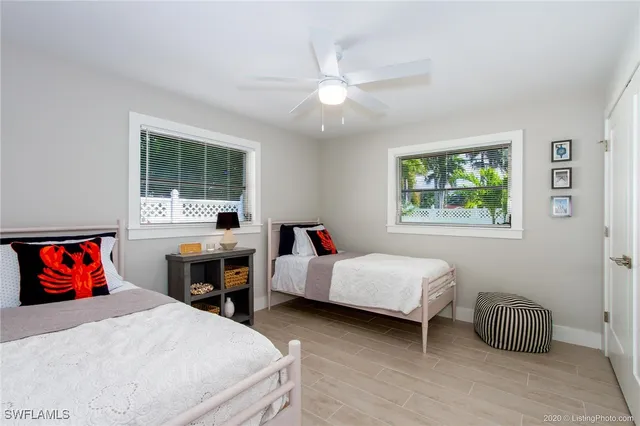 a bedroom with furniture and a window