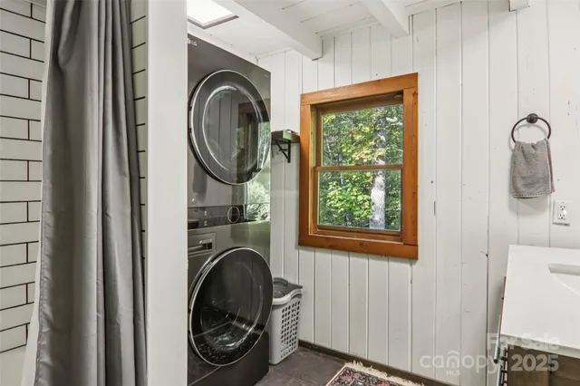 a view of a wooden house with a yard