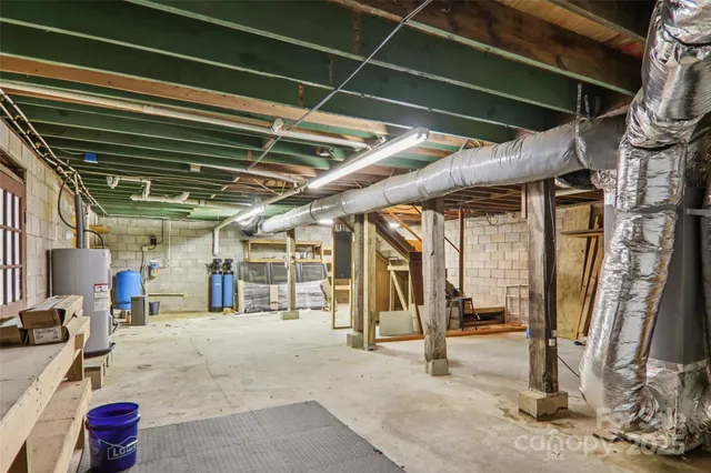 a backyard of a house with a yard and outdoor seating