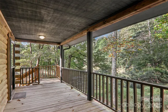 a view of a house with large trees