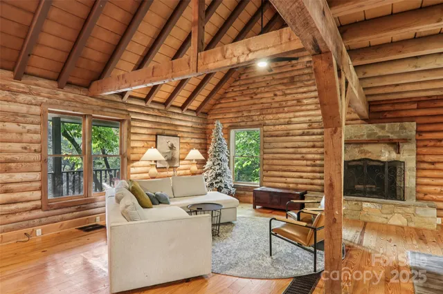 a kitchen with stainless steel appliances granite countertop table chairs sink and cabinets