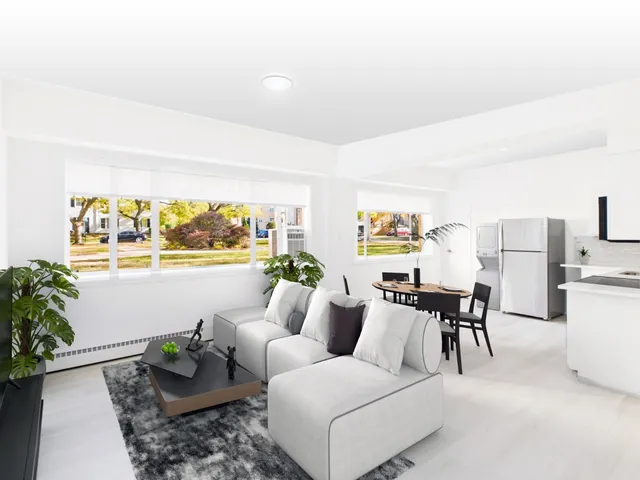 a living room with furniture and flowers