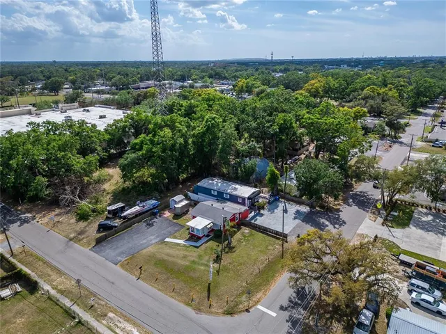 an aerial view of a house with a yard
