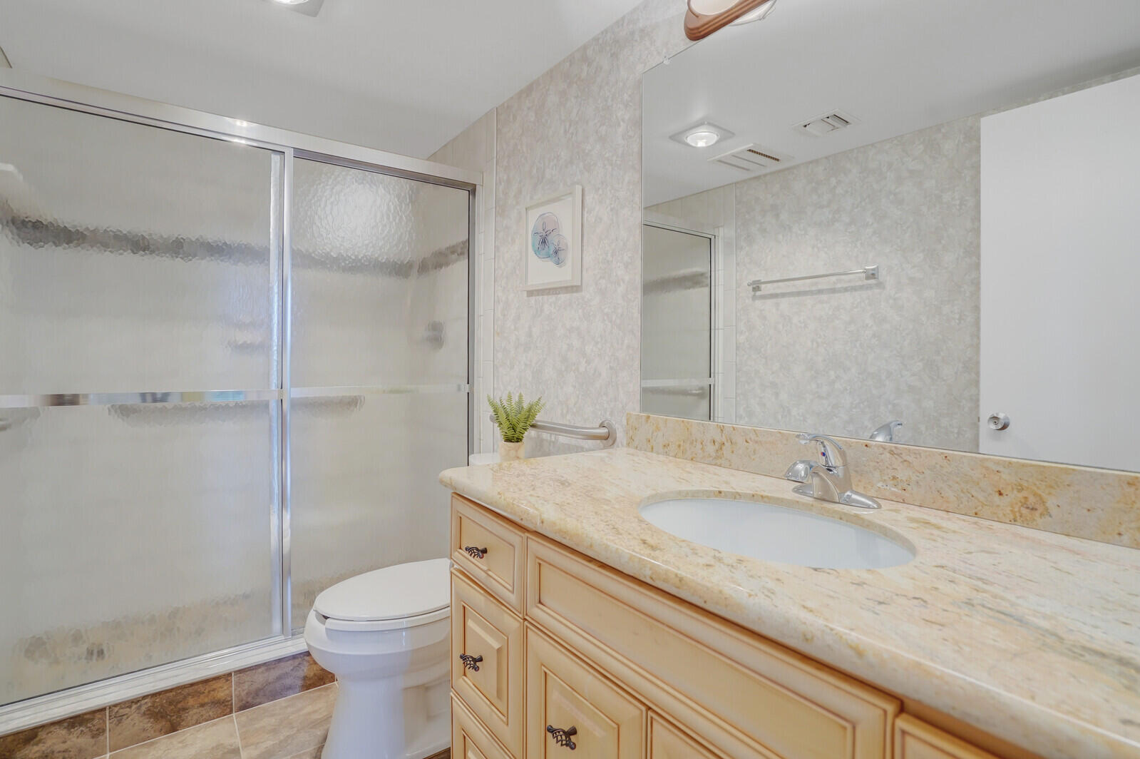 2667 North Ocean Boulevard, Unit I312 Boca Raton, FL 33431 - Photo 26 of 77 a bathroom with a granite countertop sink toilet and shower