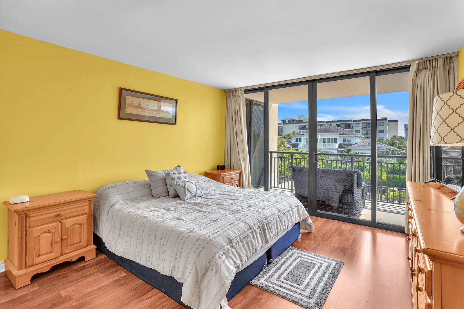 2667 North Ocean Boulevard, Unit I312 Boca Raton, FL 33431 - Photo 27 of 77 a bedroom with a bed and wooden floor