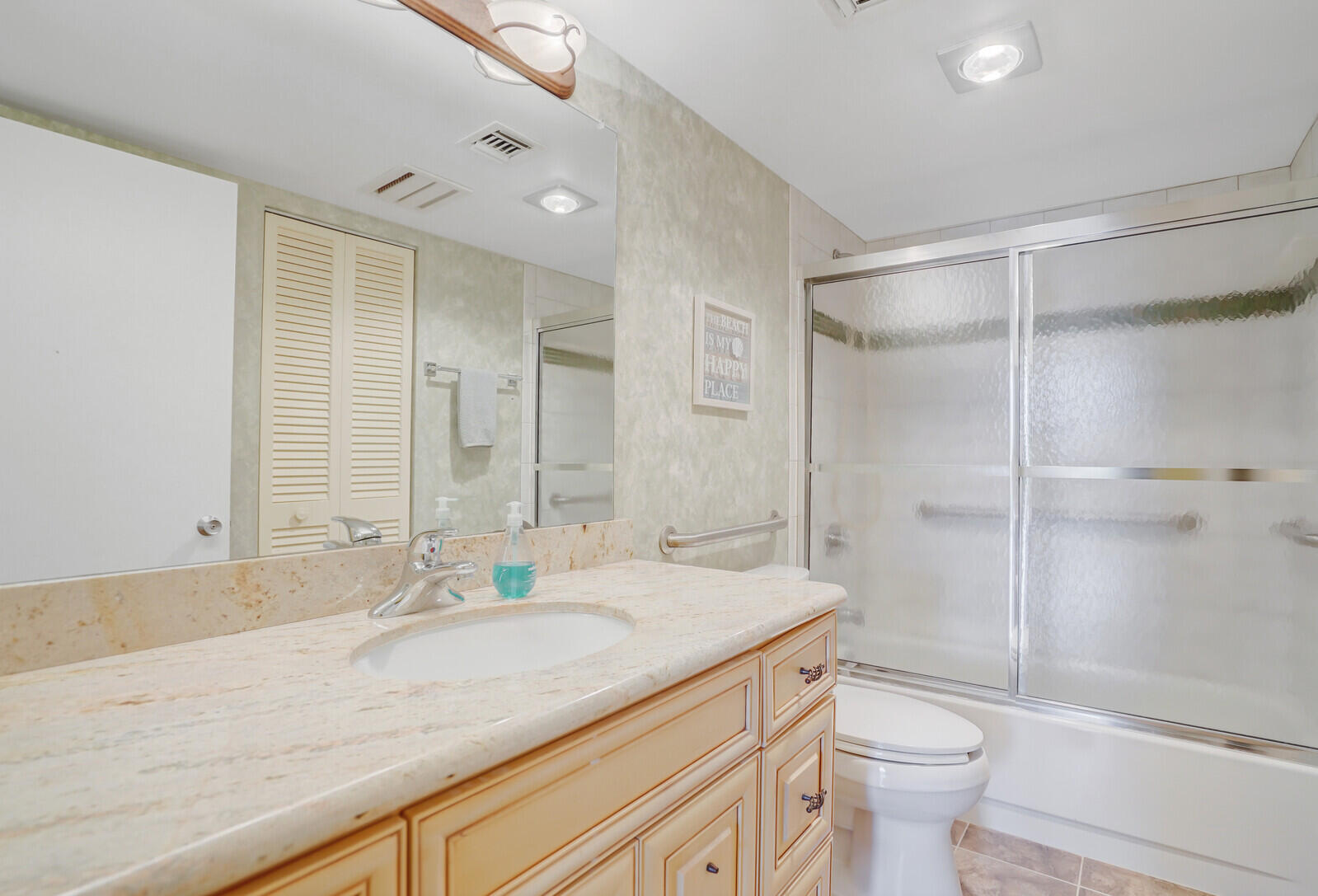 2667 North Ocean Boulevard, Unit I312 Boca Raton, FL 33431 - Photo 28 of 77 a bathroom with a granite countertop sink toilet and shower