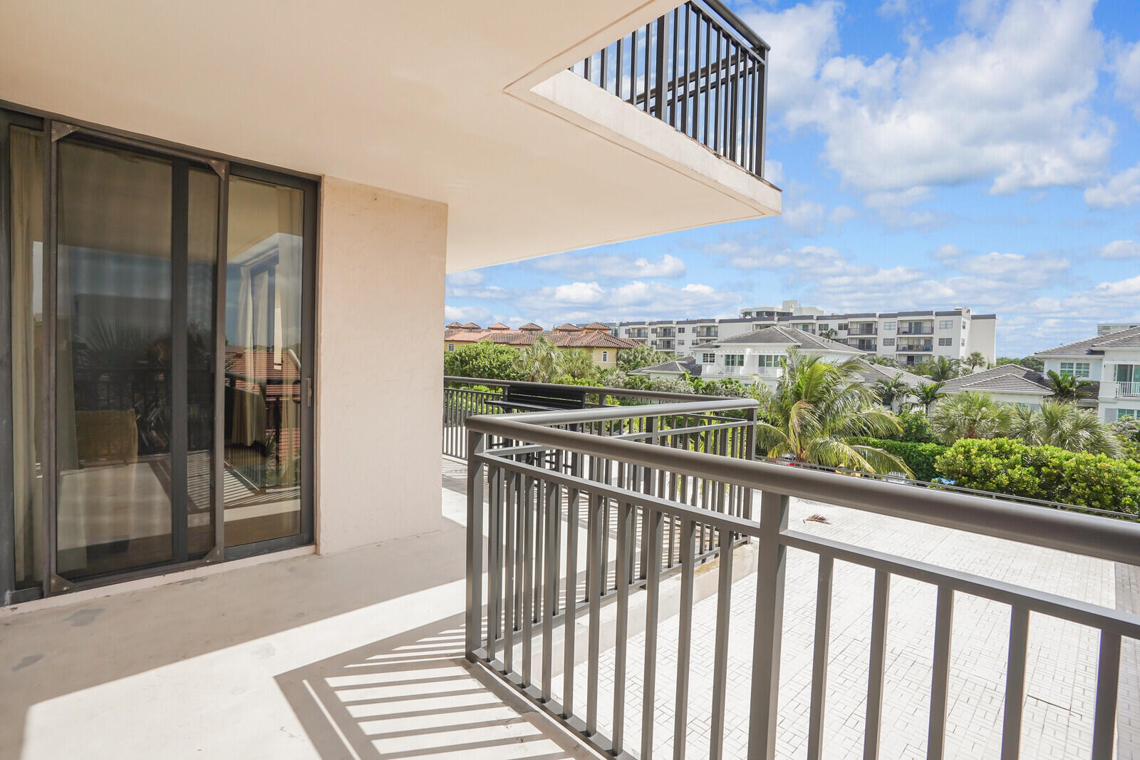 2667 North Ocean Boulevard, Unit I312 Boca Raton, FL 33431 - Photo 30 of 77 a view of a balcony with wooden floor and city view