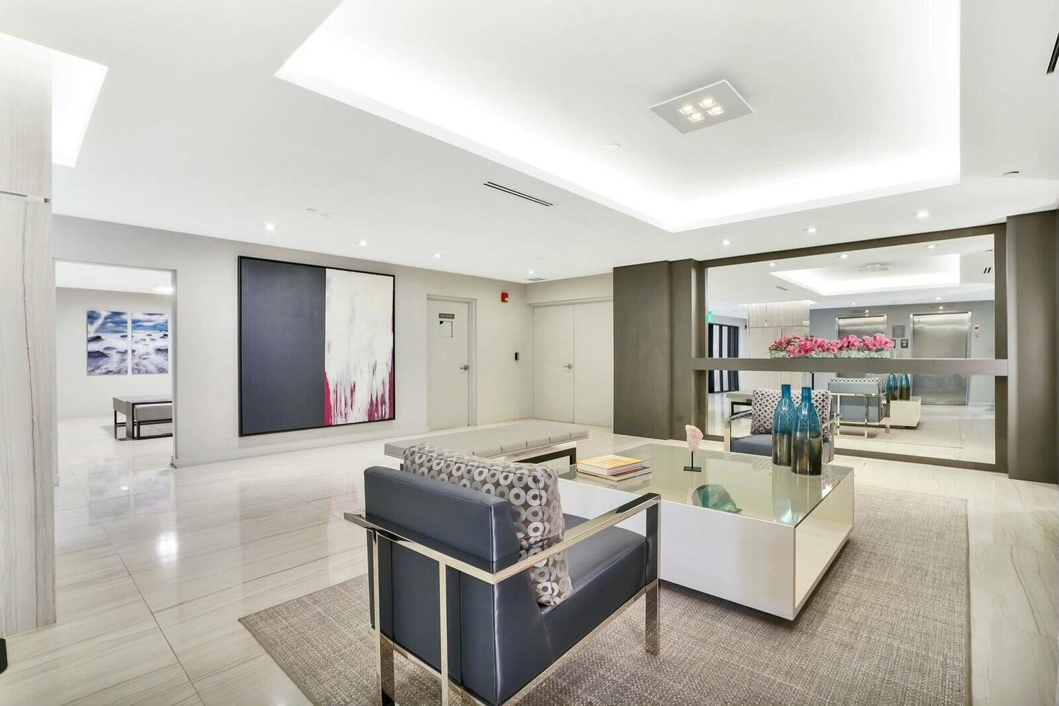 2667 North Ocean Boulevard, Unit I312 Boca Raton, FL 33431 - Photo 6 of 77 a living room with furniture and a flat screen tv