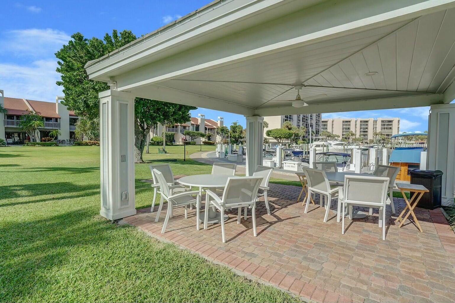 2667 North Ocean Boulevard, Unit I312 Boca Raton, FL 33431 - Photo 61 of 77 a view of a dining room with furniture window and outside view