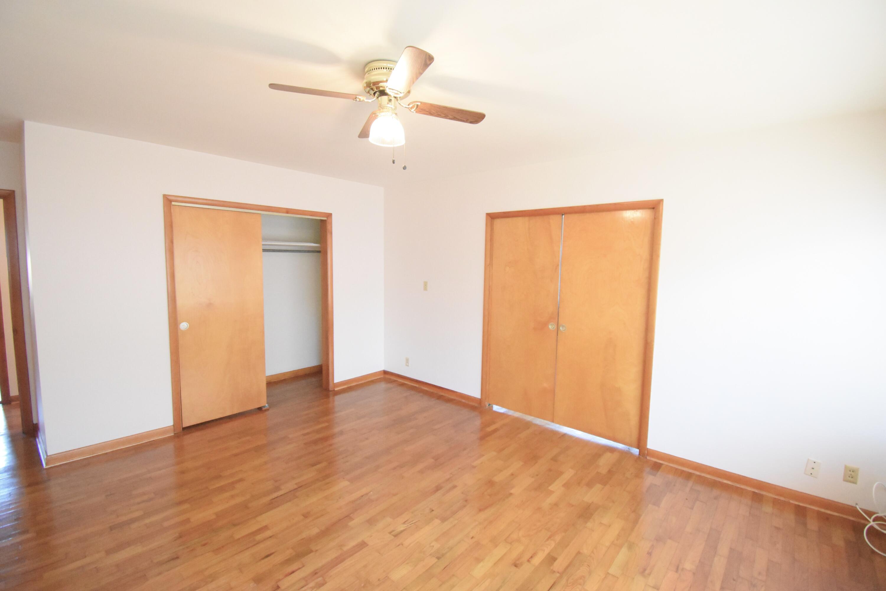 328 South Weston Street Rensselaer, IN 47978 - Photo 17 of 39 a view of an empty room with wooden floor