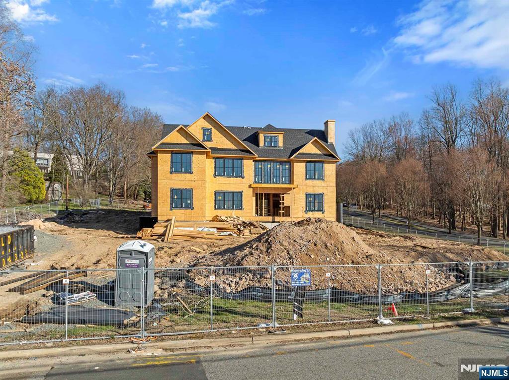 379 Anderson Avenue Alpine, NJ 07620 - Photo 8 of 15 a front view of a house with a yard
