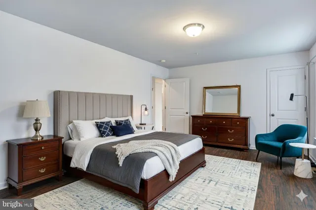 a bedroom with a bed and a couch