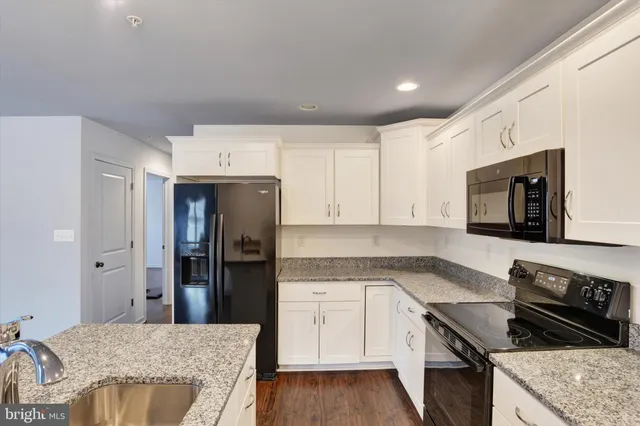 a kitchen with a stove and a refrigerator