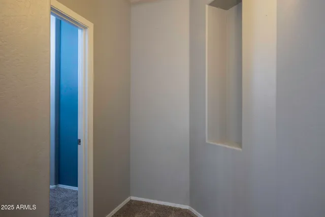 a view of a room with a wardrobe space
