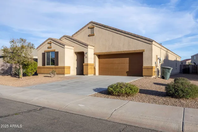 a view of a backyard with plants and outdoor kitchen
