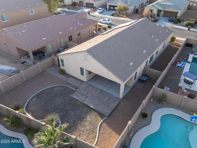 an aerial view of a house with a lake view