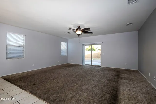 a view of kitchen and kitchen with a decorative ceiling fan