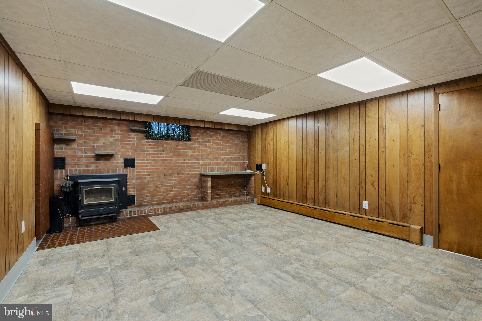 218 Lauschtown Road Denver, PA 17517 - Photo 49 of 78 a view of an empty room with a fireplace