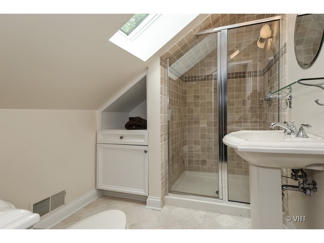 318 Forest Road Hinsdale, IL 60521 - Photo 18 of 23 a bathroom with a sink a mirror and shower