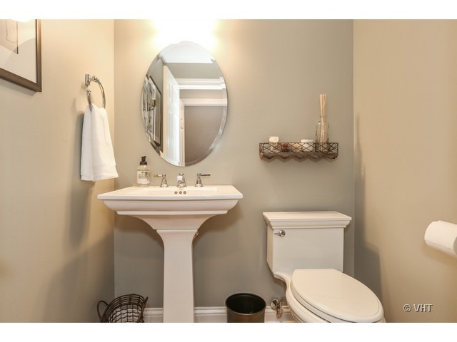 318 Forest Road Hinsdale, IL 60521 - Photo 10 of 23 a bathroom with a toilet sink and mirror