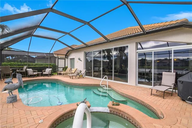 a view of a chairs and table in the balcony