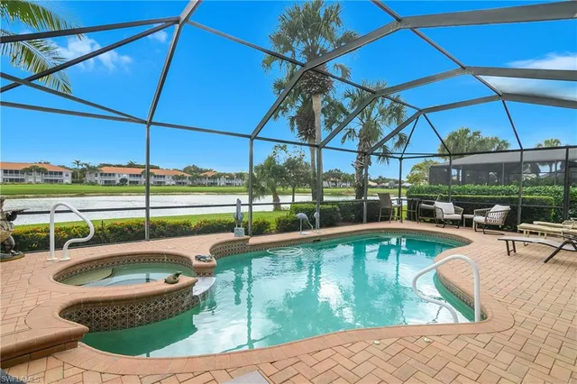 a view of a swimming pool with a patio