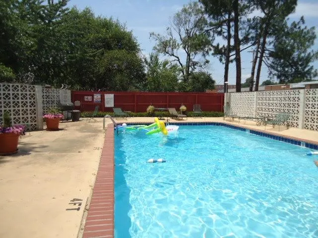 a view of a swimming pool with a patio