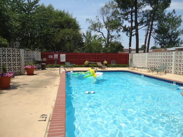 3080 Walnut Grove Road, Unit 205 Memphis, TN 38111 - Photo 2 of 26 a view of a swimming pool with a patio