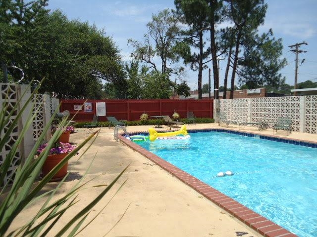 3080 Walnut Grove Road, Unit 205 Memphis, TN 38111 - Photo 23 of 26 a view of swimming pool with chairs