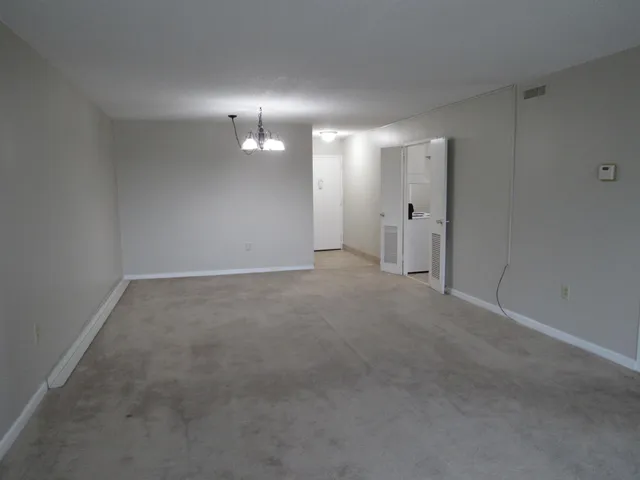a kitchen that has a sink a stove and refrigerator