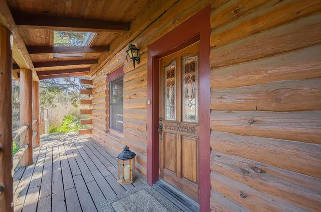 a living room with lots of furniture and a book shelf