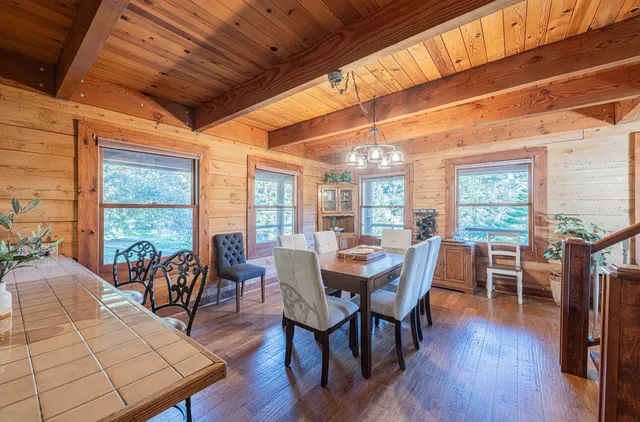 a view of a dining room with furniture window and wooden floor