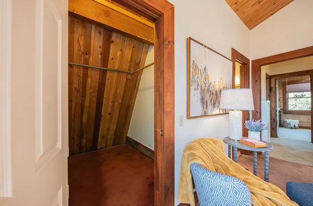 a bathroom with a granite countertop toilet sink and mirror
