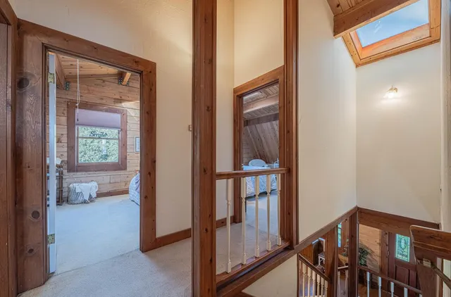 a bedroom with a bed and a table