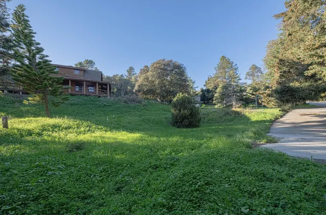 an aerial view of a house with yard swimming pool and outdoor seating